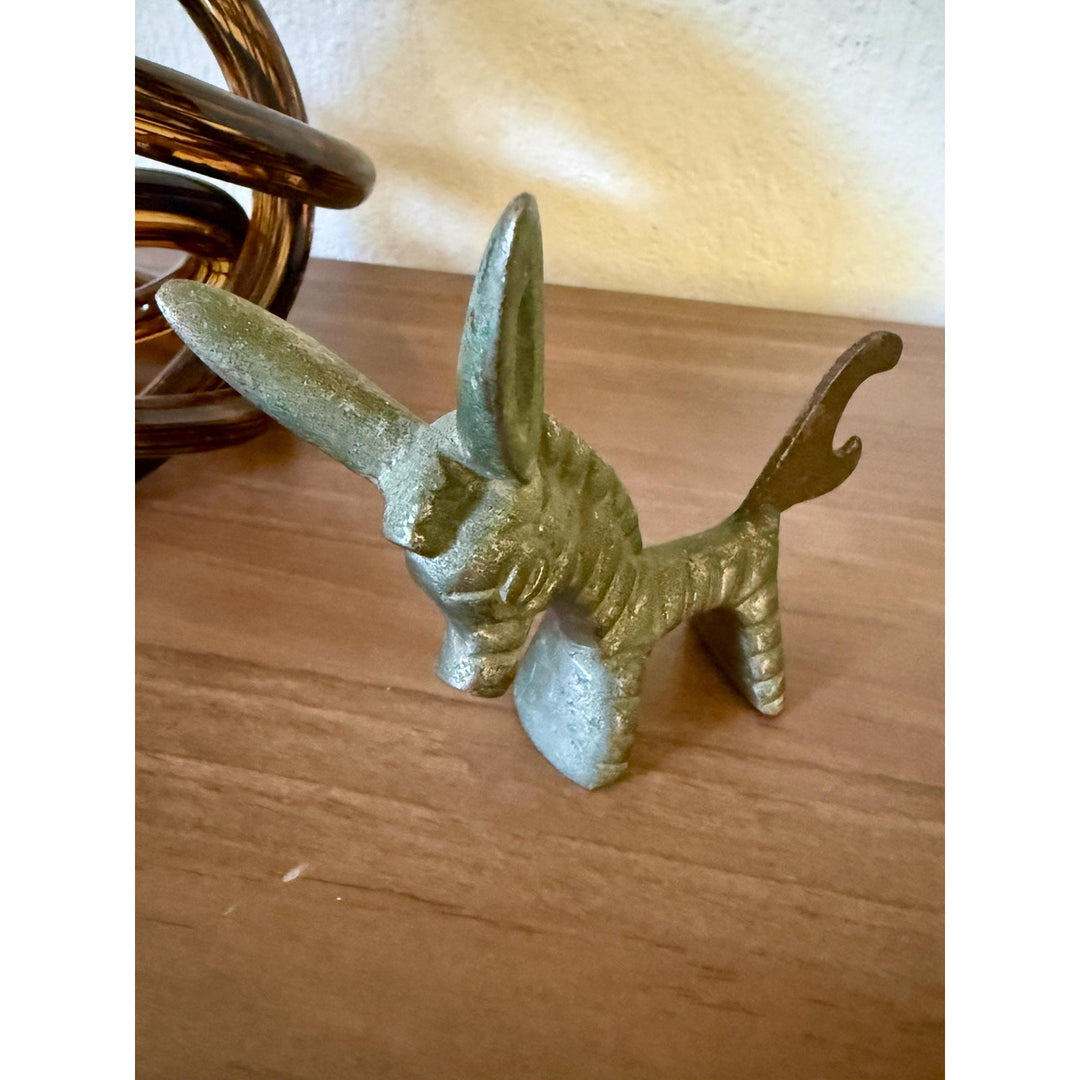 Vintage Walter Bosse brass donkey bottle opener with aged patina and Mid-Century Modern styling.