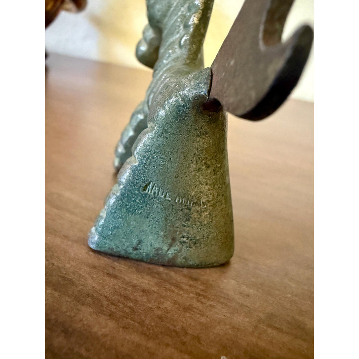 Vintage Walter Bosse brass donkey bottle opener with aged patina and Mid-Century Modern styling.
